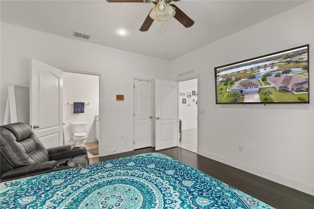 An ensuite bathroom with a step-in shower and walk-in closet make this bedroom a perfect Guest Suite.