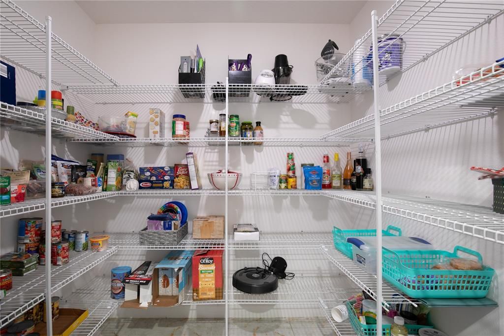 Here's that walk-in pantry I told you about with floor to ceiling shelving.