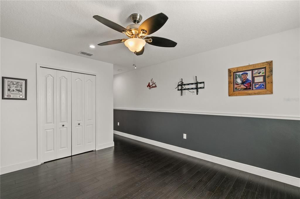 Bedroom #3 has a double built-in closet, laminate flooring, 4" baseboards, ceiling fan and chair rails.