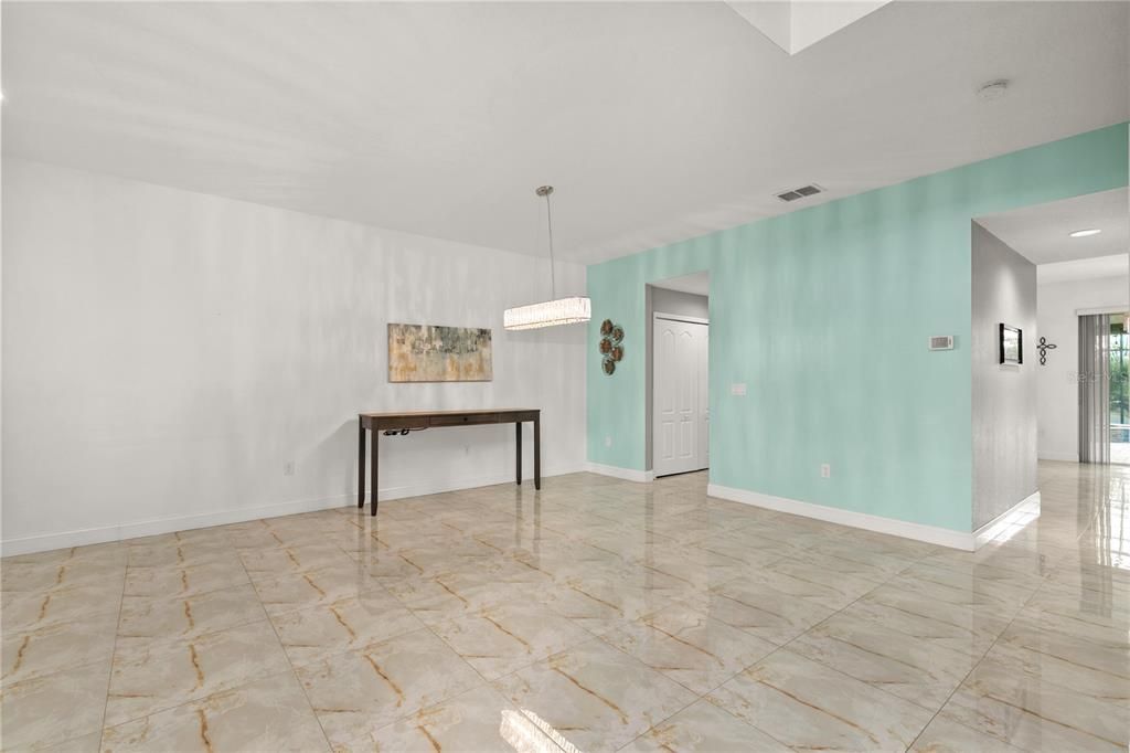 As you head to the kitchen you will pass the half guest bath on the right and to the left are two pantries, one is a double built-in and the second is a full walk in pantry.