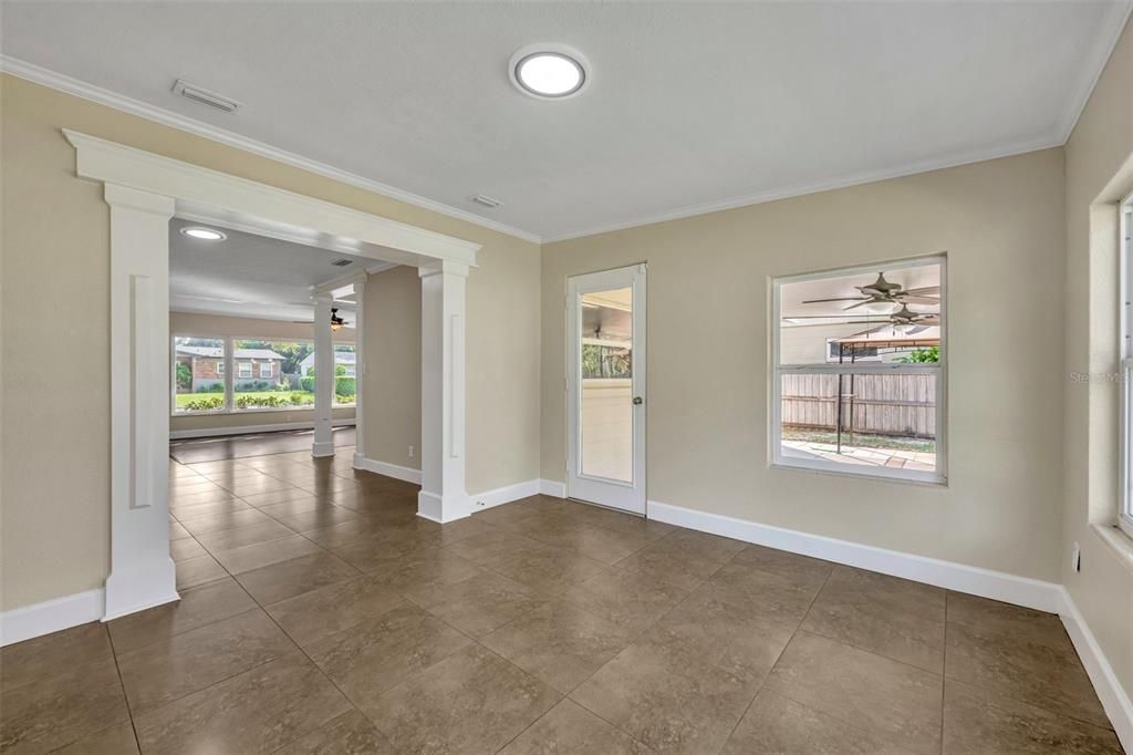 Florida room behind the dining room offers flex space