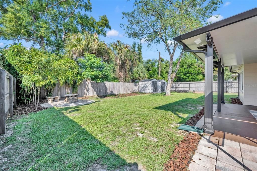 Large, landscaped fenced-in backyard