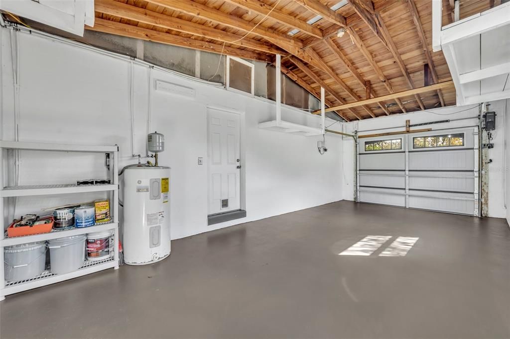 1-car garage with (3) floating shelves for storage