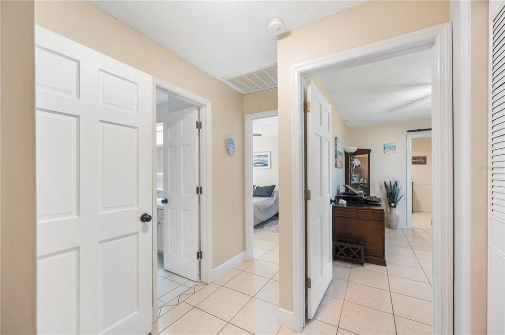 Hallway shows entrace to in-law suite and hallway bathroom and bedroom