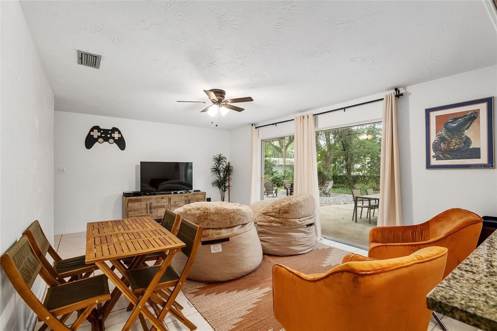 second living room leading to backyard area