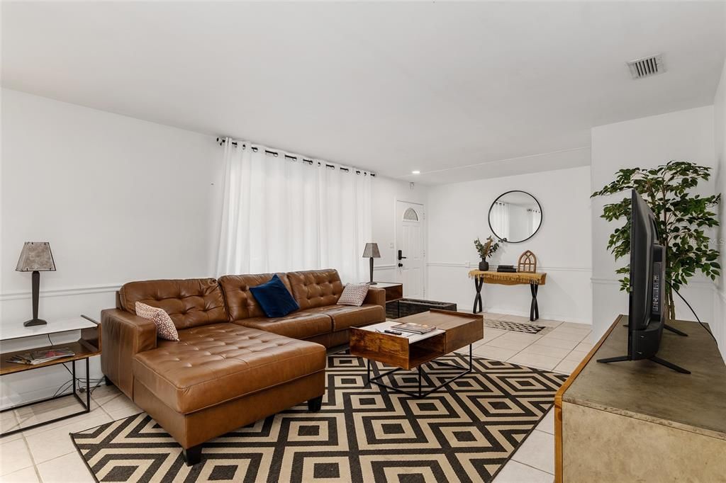 front door to entryway and formal living room