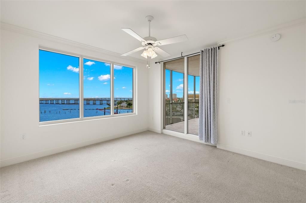 Primary Bedroom with sliding door to the screened lanai