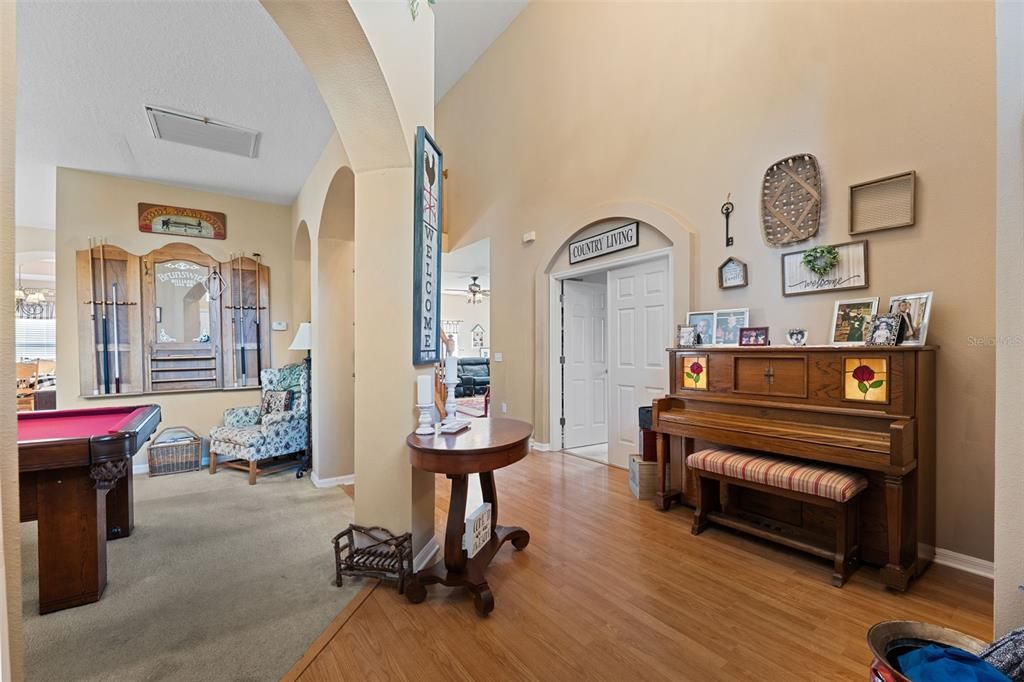 Player piano and entrance to office on right