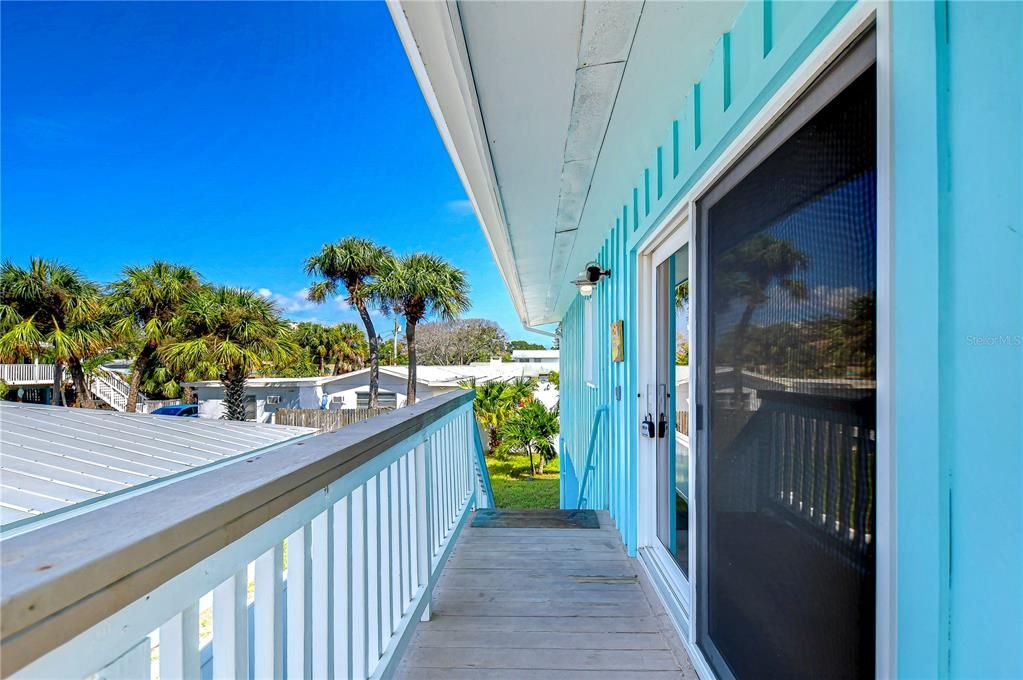 Up the stairs you'll be greeted by the sliding glass door that gives you access to our kitchen