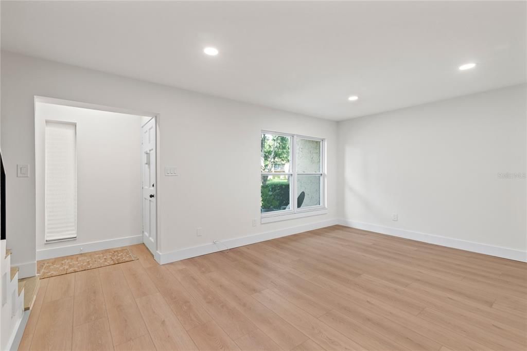 FAMILY ROOM AND FOYER - OVERLOOKING A PARK LIKE SETTING