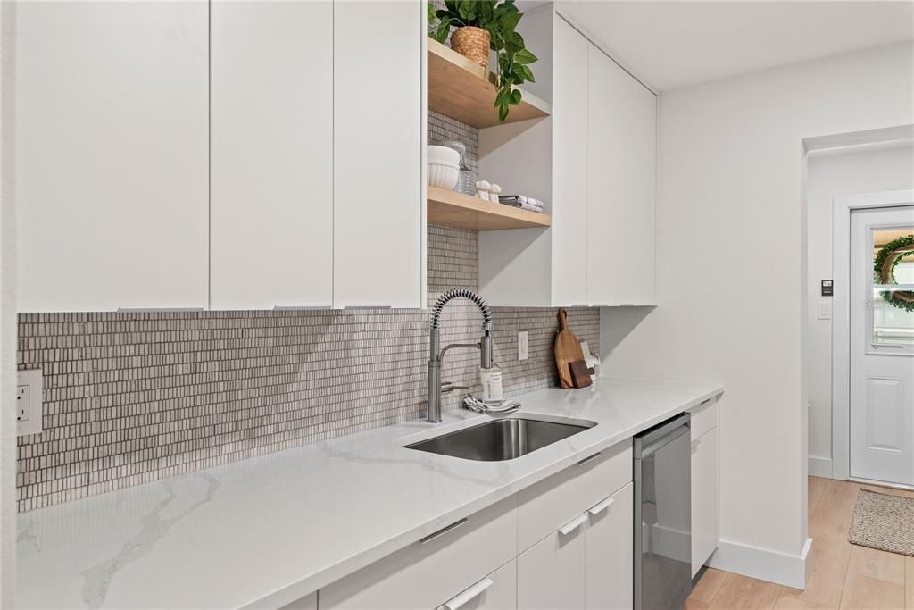 OPEN SHELVING GIVES THIS KITCHEN A MODERN LOOK