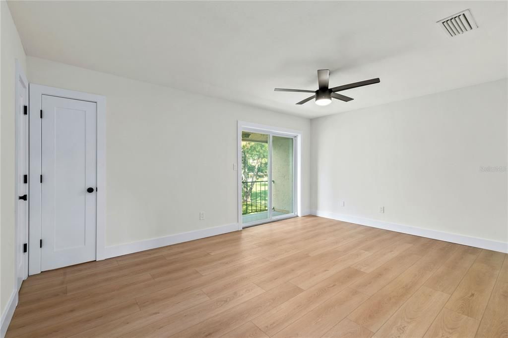 HUGE BEDROOM WITH OVERSIZED CLOSET NEW SLIDING GLASS DOORS AND A LOVELY VIEW