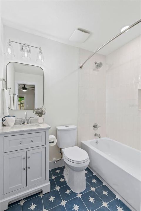 BRIGHT AND AIRY ENSUITE BATHROOM. VERTICAL WHITE TILE COMBINED WITH TWINKLING BLUE PORCELAIN GIVES THIS BATH A FRESH FEEL!