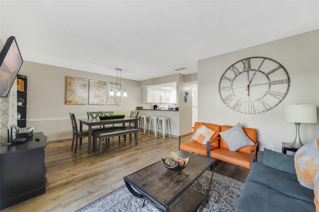 This END-UNIT comes FULLY FURNISHED and ready for the new owner who will enjoy the WOOD LAMINATE FLOORS THROUGHOUT, bright OPEN CONCEPT living and dining spaces, an updated kitchen featuring GRANITE COUNTERS, in-unit laundry and there is even a SCREENED PATIO for comfortable outdoor living.