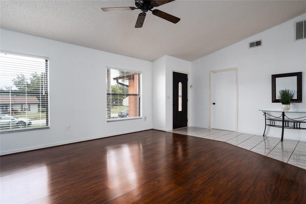 Main living area towards entrance and garage. The front door is newer.