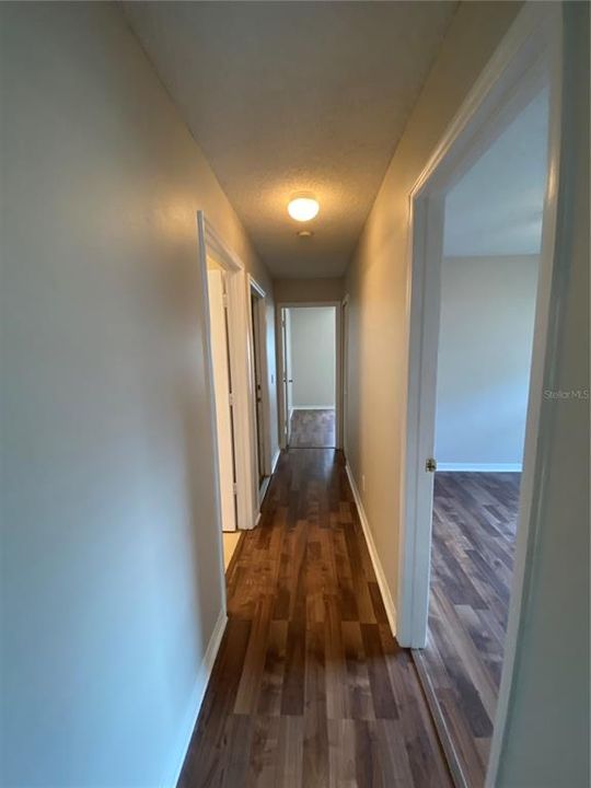 Hallway (leading to additional bedrooms, bathroom and garage)