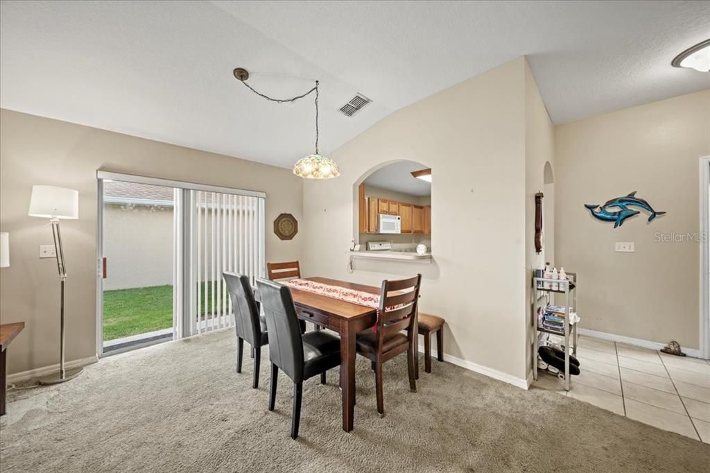 View from the dining room into the kitchen.