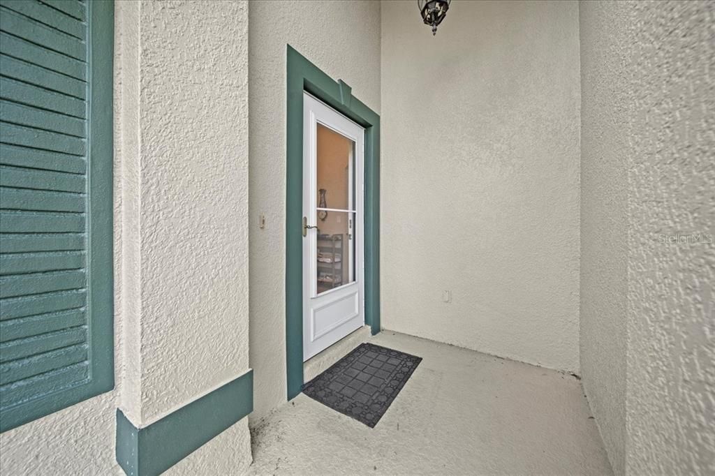 Entrance Way with Glass Storm Door.