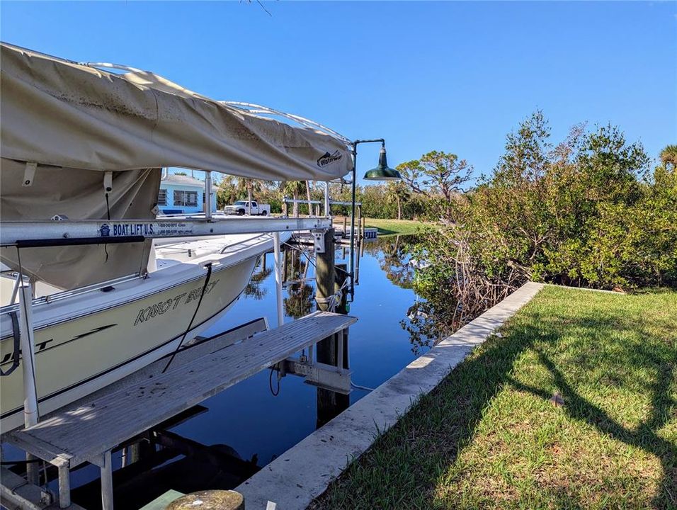 Canal is four homes to Lemon Bay where dolphins play! Concrete cap on sea wall