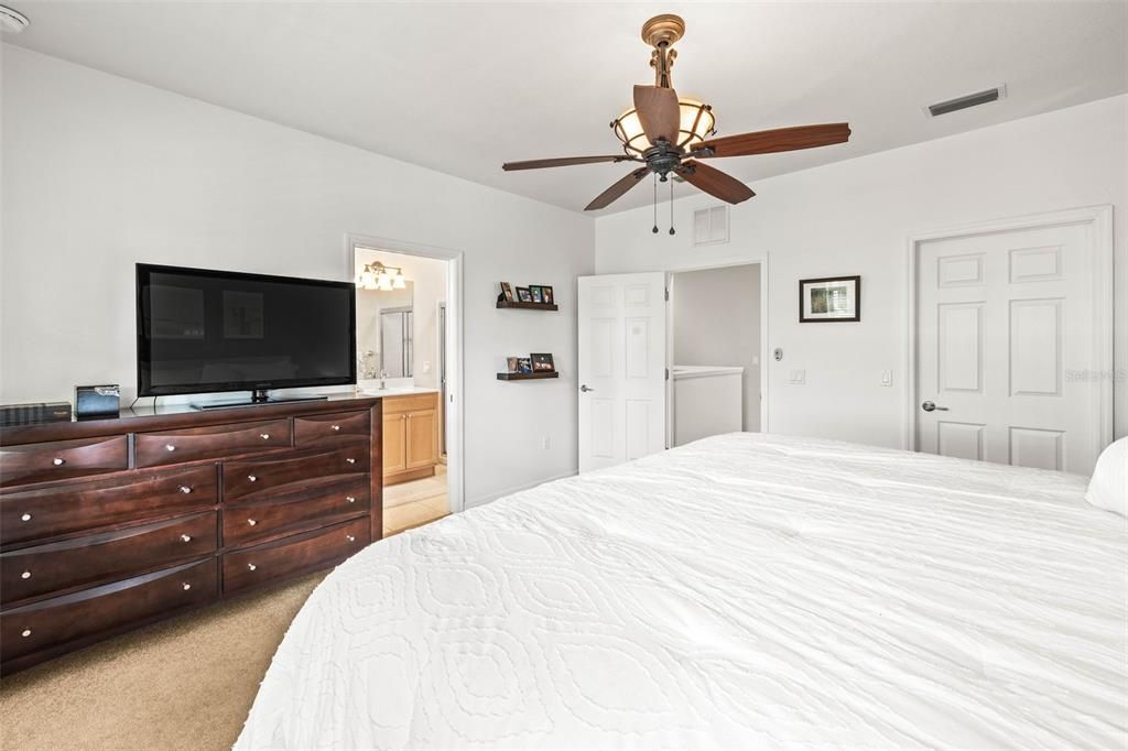 Ensuite Master Bedroom with Bathroom. Ceiling Fan, Walk in closet and carpet