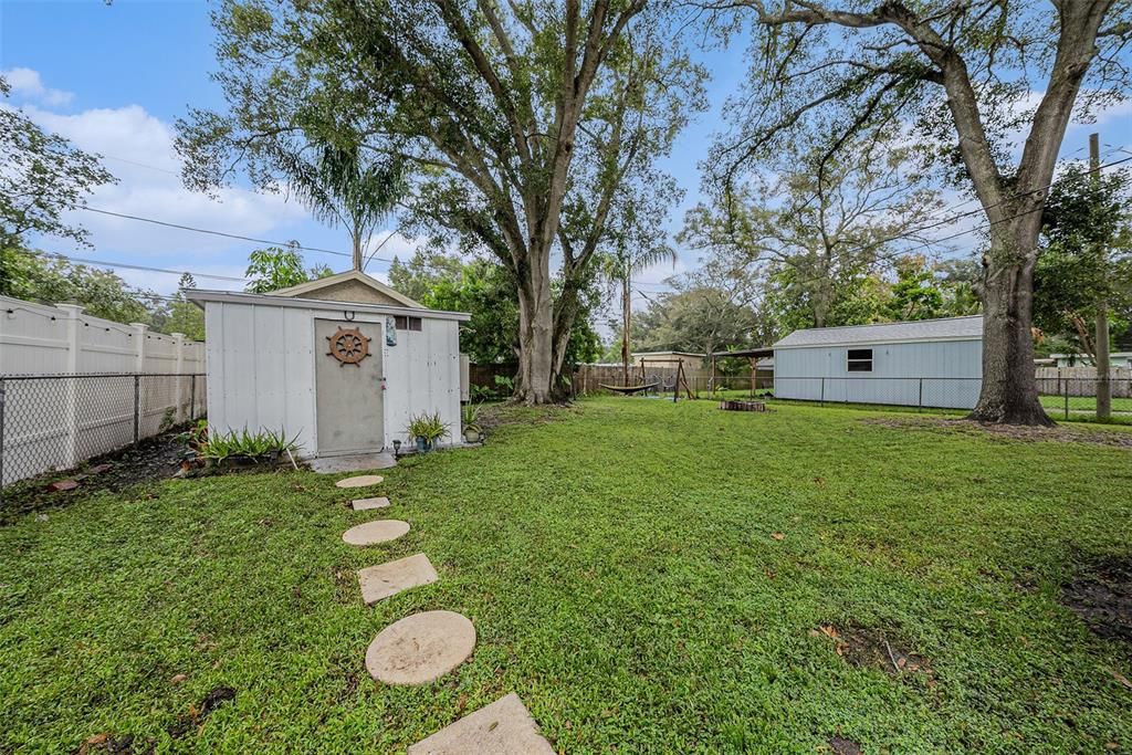 Large Fenced In Backyard. Shed stays