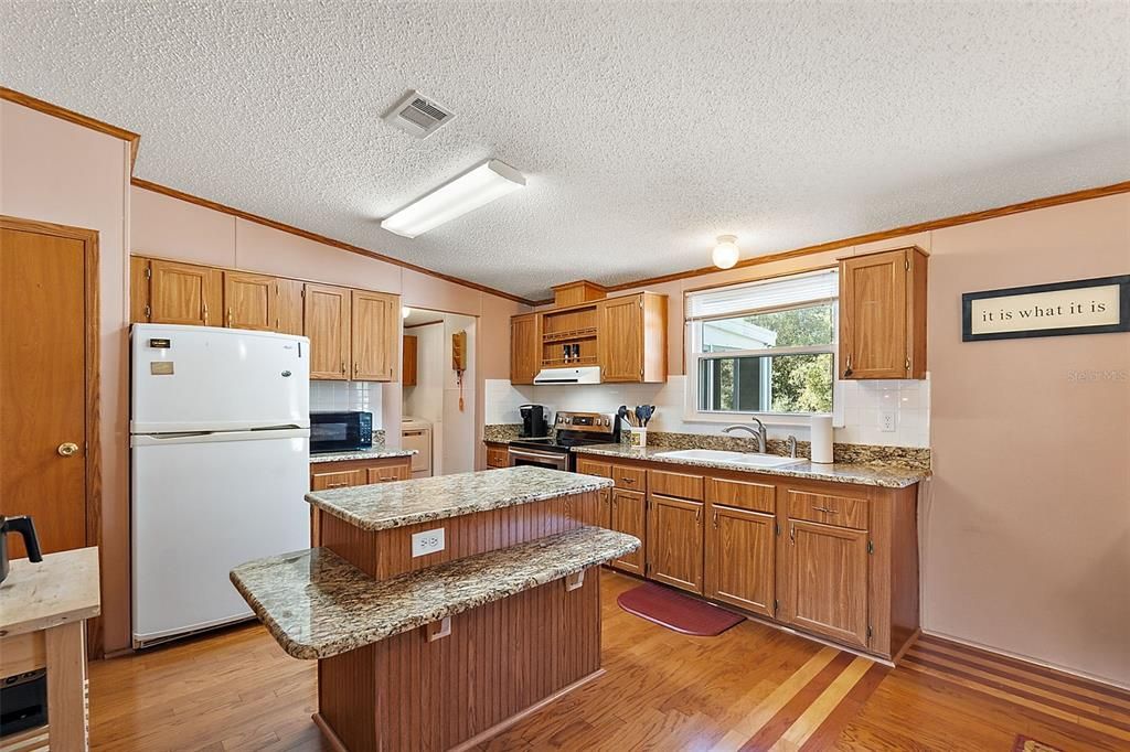 Kitchen with stone countertops and island