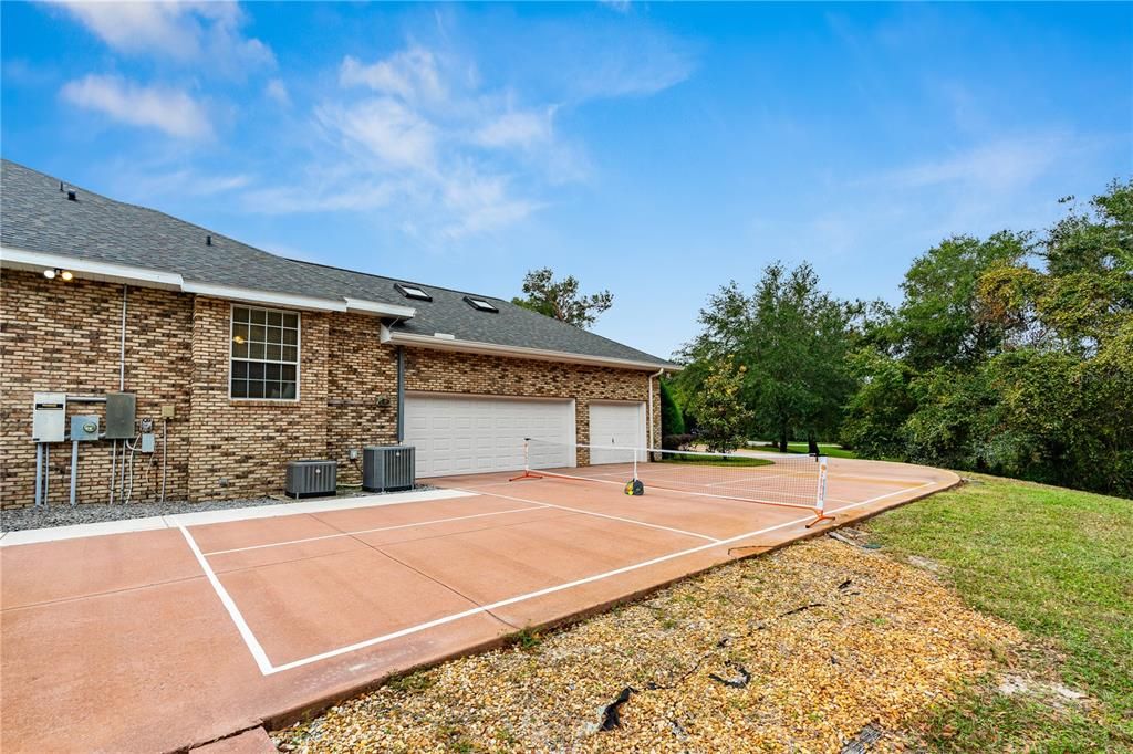 Driveway is g=huge- has a picklball court painted on