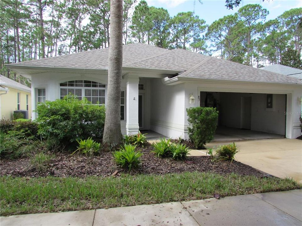 Exterior with 2 car garage-roof replaced in 2022