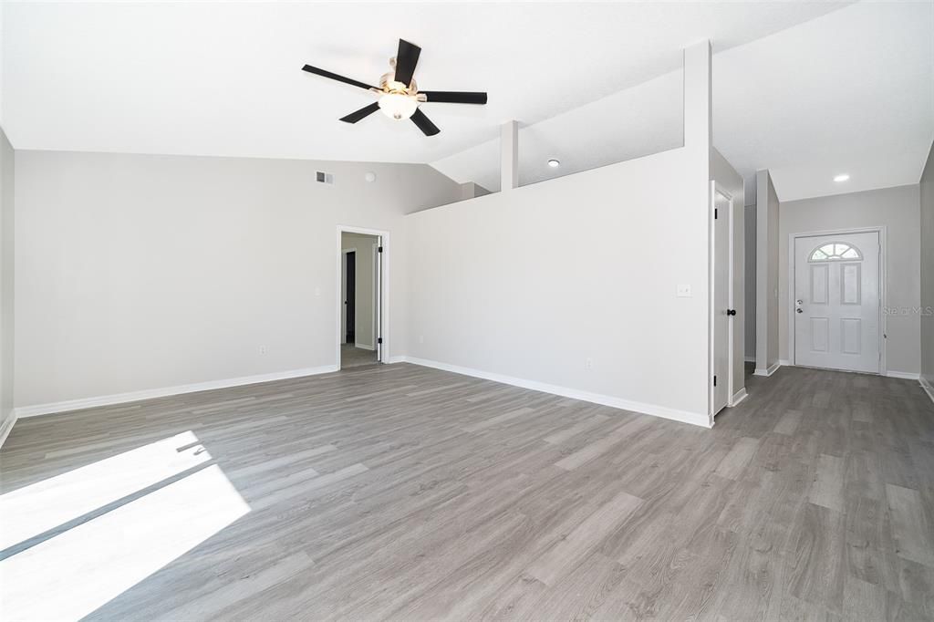 Living/Dining Room Facing Kitchen & Foyer