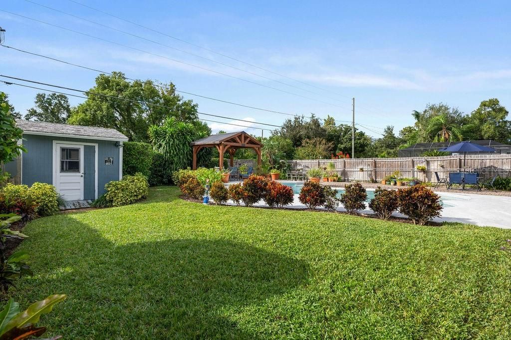 Lush side yard with Shed