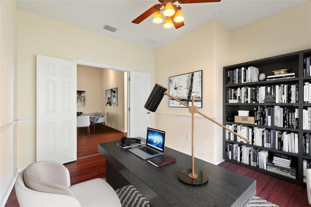 Virtually staged Den has double door access to great room