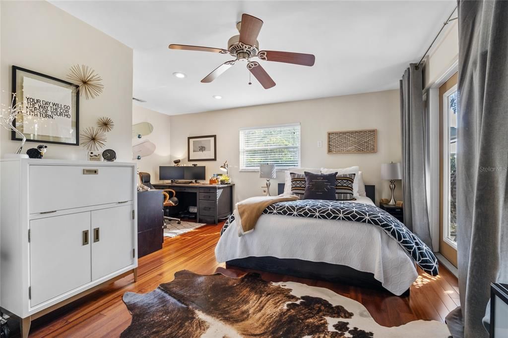 This Guest Bedroom is spacious and has doors leading out to the Lanai.