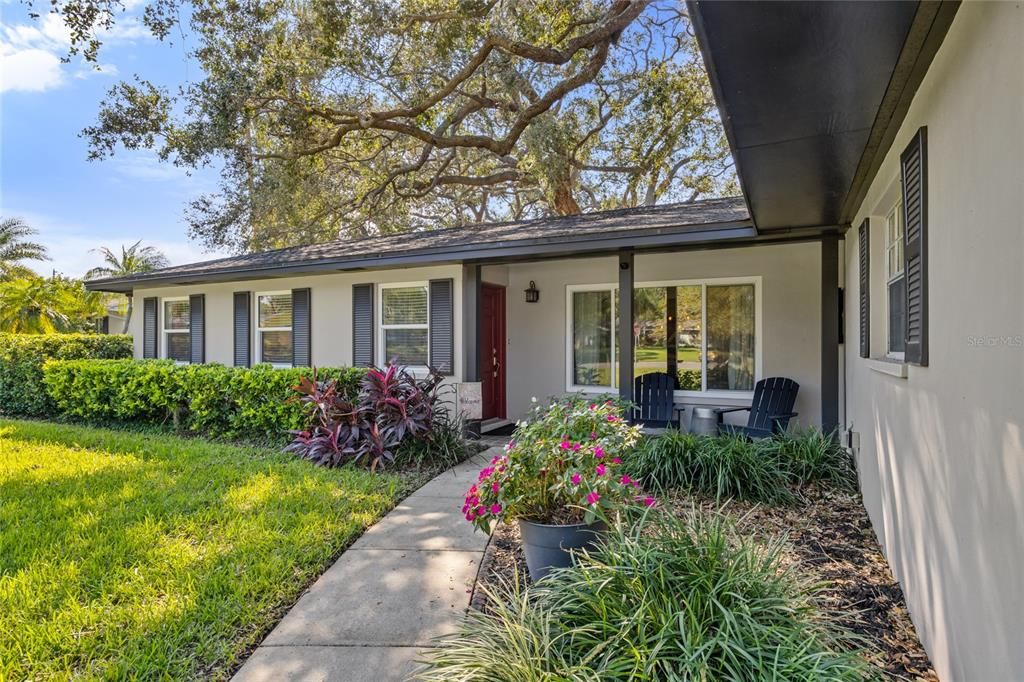 An inviting covered porch welcomes you to the front door