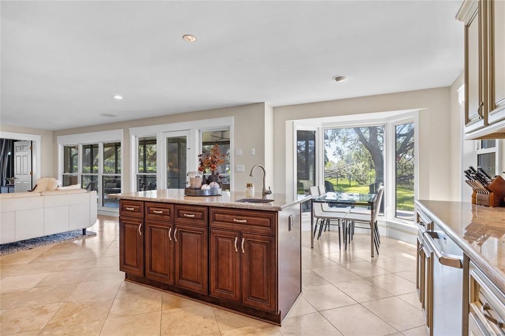 The back of the home features floor to ceiling windows providing an incredible view of the back yard and golf course!