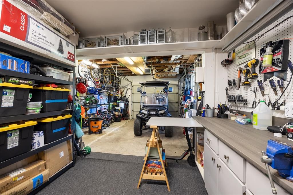 Don't let the "one car" garage fool you!   The garage is oversized and has a great workshop area and ample storage.