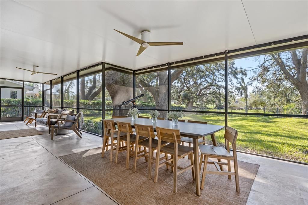 This Lanai may be where you end up spending most of your time!    Spanning the entire back of the home it is covered and screened and has tranquil views of the back yard and golf course.