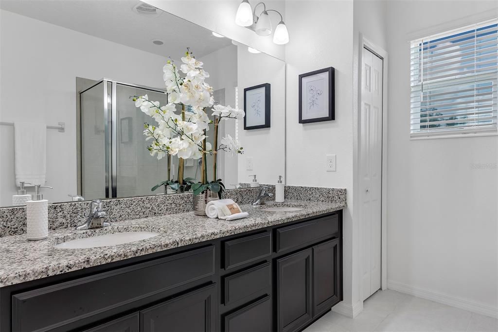 Primary Bathroom with walk in shower and private water closet