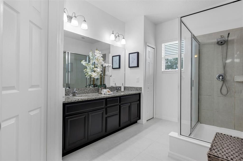 Primary Bathroom with walk in shower and private water closet