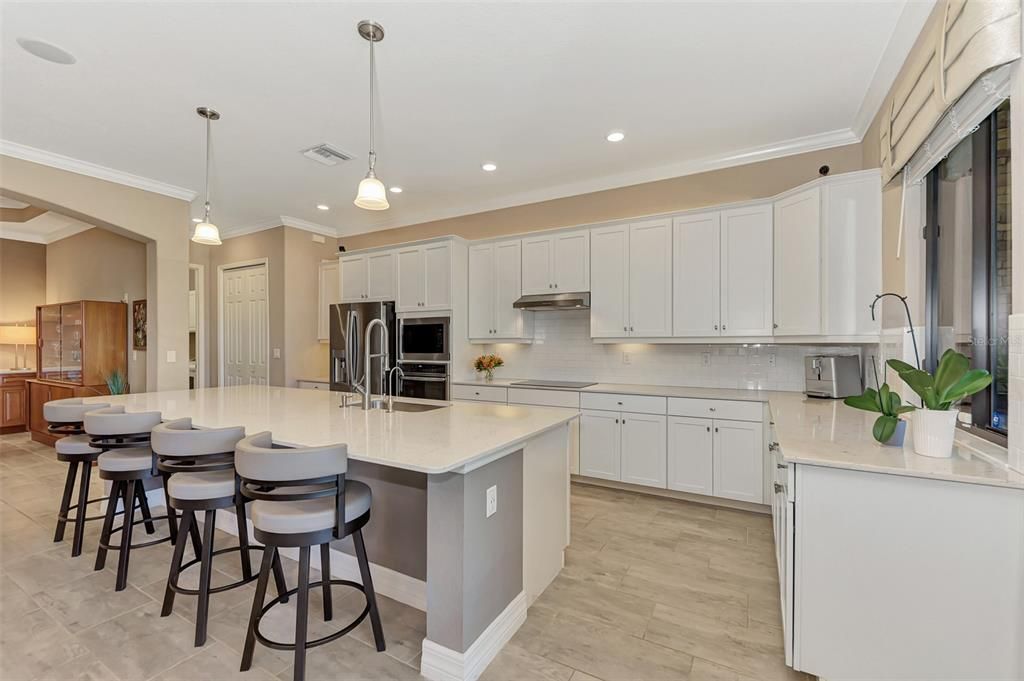 Kitchens have to be a favorite in these homes - large 12' islands - this is all quartz - for the baker or chef in your family - farm sink, new plumbing, convection ovens, truly upscale living.