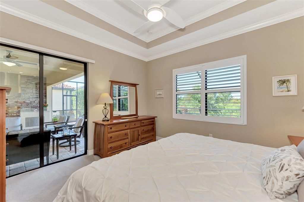 The master bedroom overlooks the back and the sunsets each evening.  A set of sliding doors enables owners to enjoy the outdoors with easy access to the pool and lanai