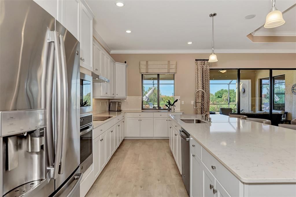 Kitchens have to be a favorite in these homes - large 12' islands - this is all quartz - for the baker or chef in your family - farm sink, new plumbing, convection ovens, truly upscale living.