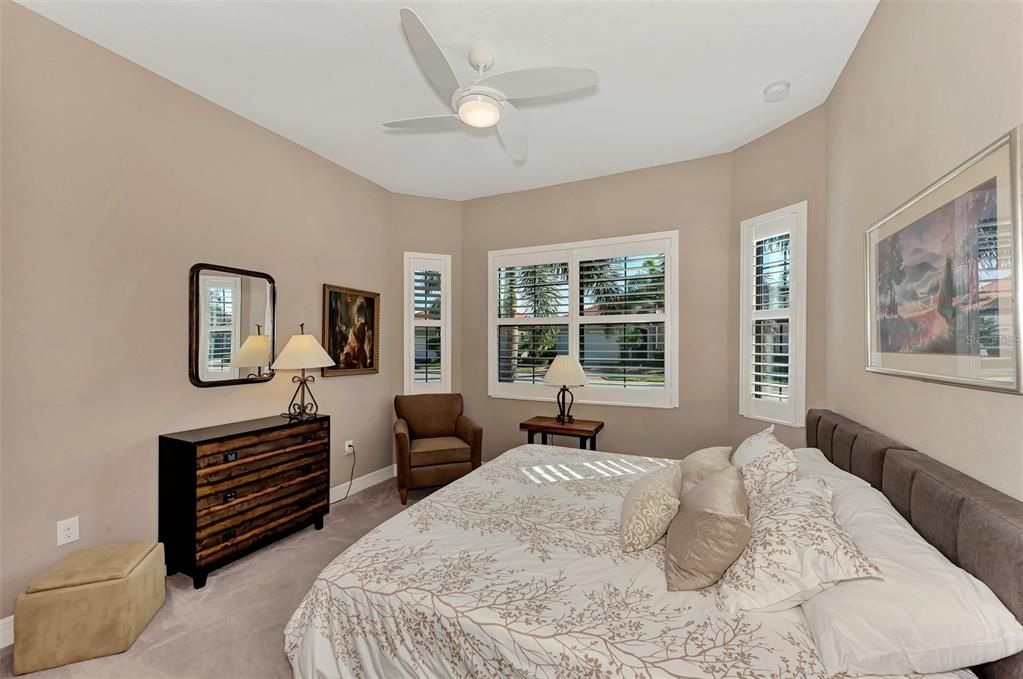 The third bedroom is set with a queen bed and has bay windows for a lot of light.