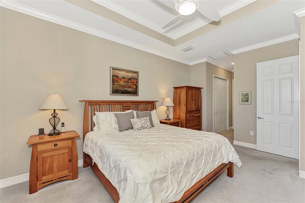 The master bedroom overlooks the back and the sunsets each evening.  A set of sliding doors enables owners to enjoy the outdoors with easy access to the pool and lanai