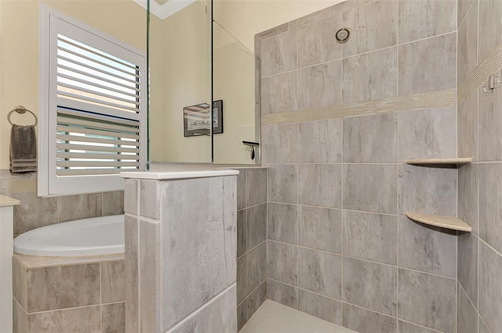 The master bath has dual sinks, a soaking tub/separate shower, and private water closet