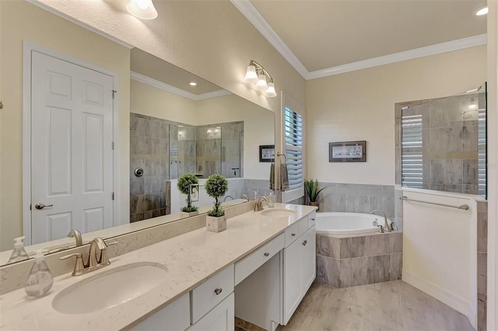 The master bath has dual sinks, a soaking tub/separate shower, and private water closet