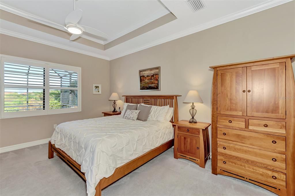 The master bedroom overlooks the back and the sunsets each evening.  A set of sliding doors enables owners to enjoy the outdoors with easy access to the pool and lanai