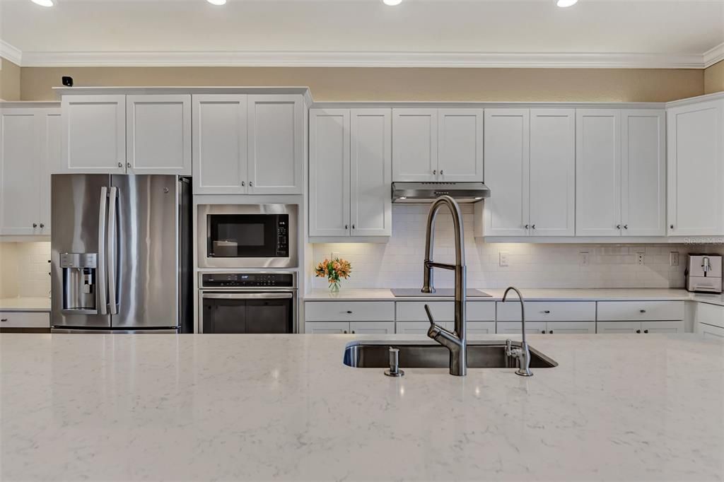 Kitchens have to be a favorite in these homes - large 12' islands - this is all quartz - for the baker or chef in your family - farm sink, new plumbing, convection ovens, truly upscale living.