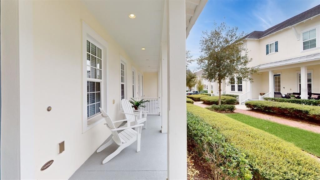 Front Covered Porch overlooking quiet Garden Courtyard.