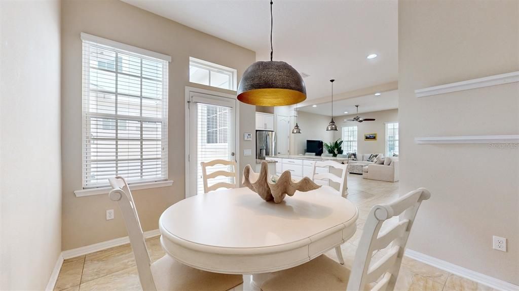 Private Dining Room view to Kitchen and back door to private Patio and Garage access.