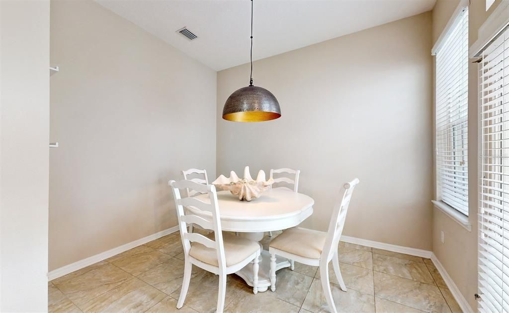 Private Dining Room with back door to Garage and Patio with Privacy Fence.